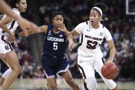 South Carolina guard Tyasha Harris (52) dribbles against Connecticut guard Crystal Dangerfield (5) during the first half of an NCAA college basketball game Monday, Feb. 10, 2020, in Columbia, S.C. (AP Photo/Sean Rayford)