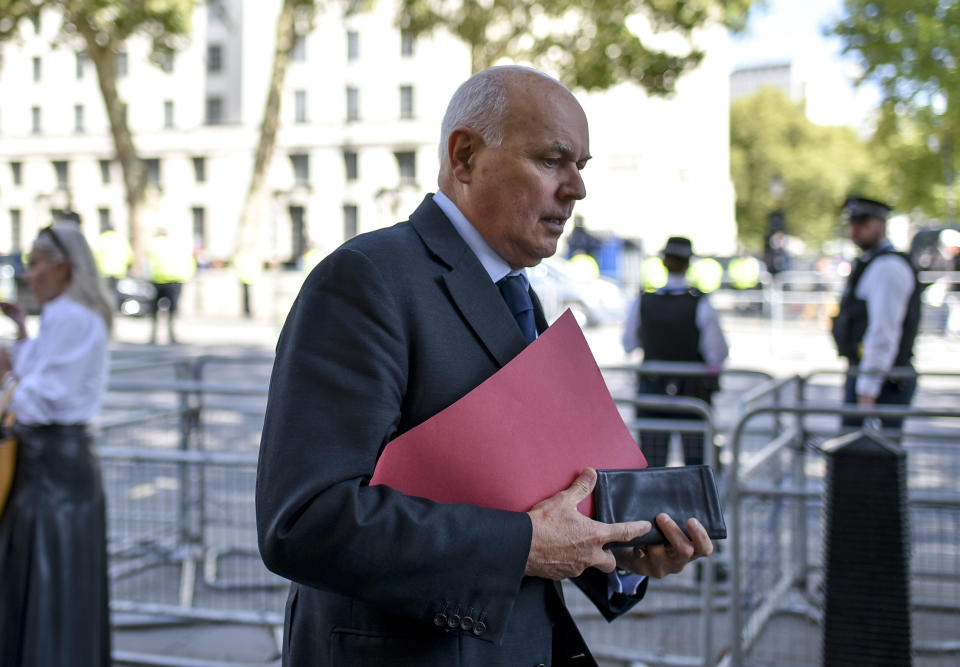 Conservative Party MP Iain Duncan Smith walks past the gates of Downing Street, in London, Thursday, Sept. 5, 2019. Prime Minister Boris Johnson kept up his push Thursday for an early general election as a way to break Britain's Brexit impasse, as lawmakers moved to stop the U.K. leaving the European Union next month without a divorce deal. (AP Photo/Alberto Pezzali)