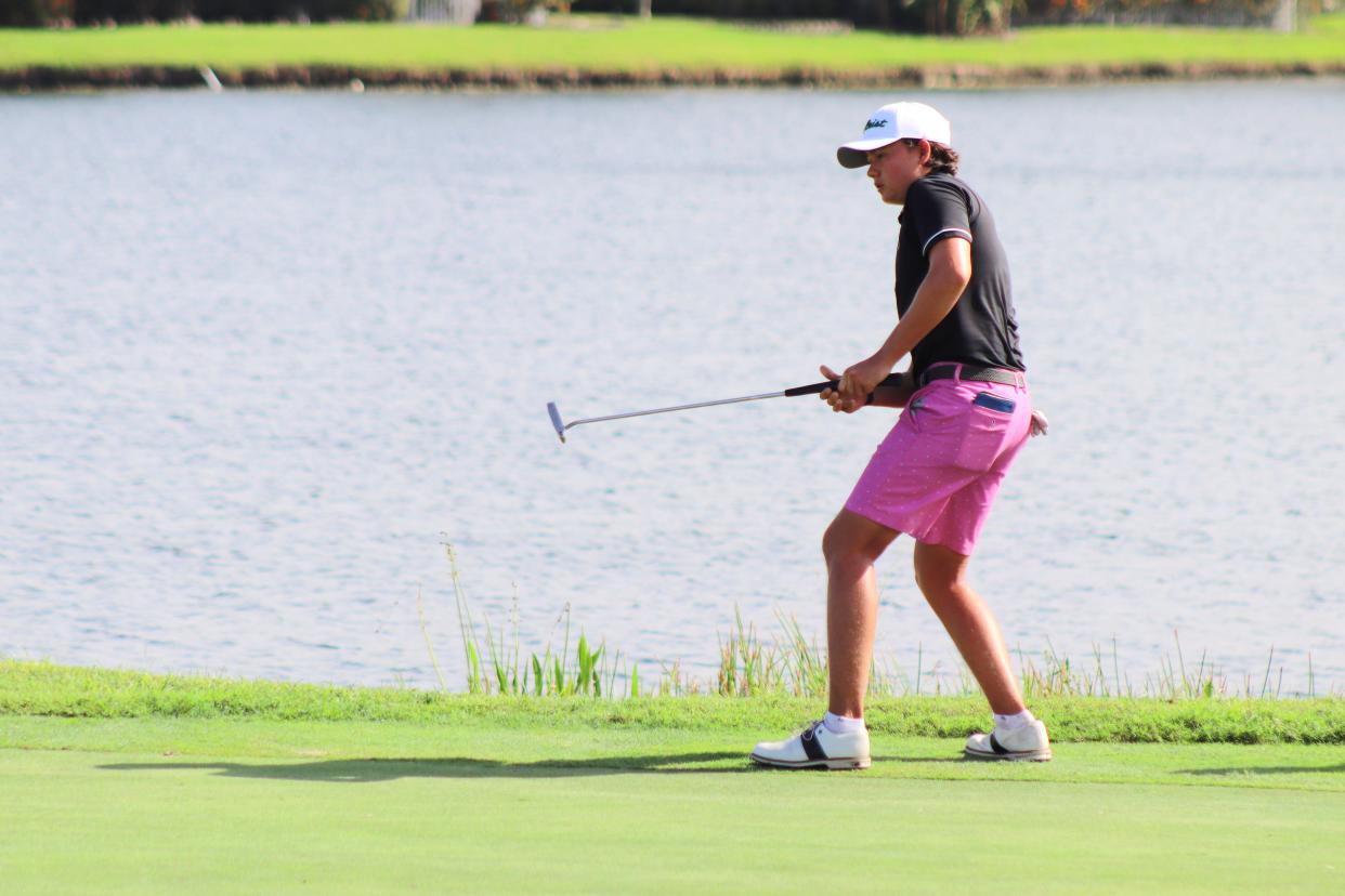 Jupiter junior Tristan Wieland bends with his final putt during the second day of The Classic of the Palm Beaches Invitational on Saturday, Oct. 14, at PGA National.