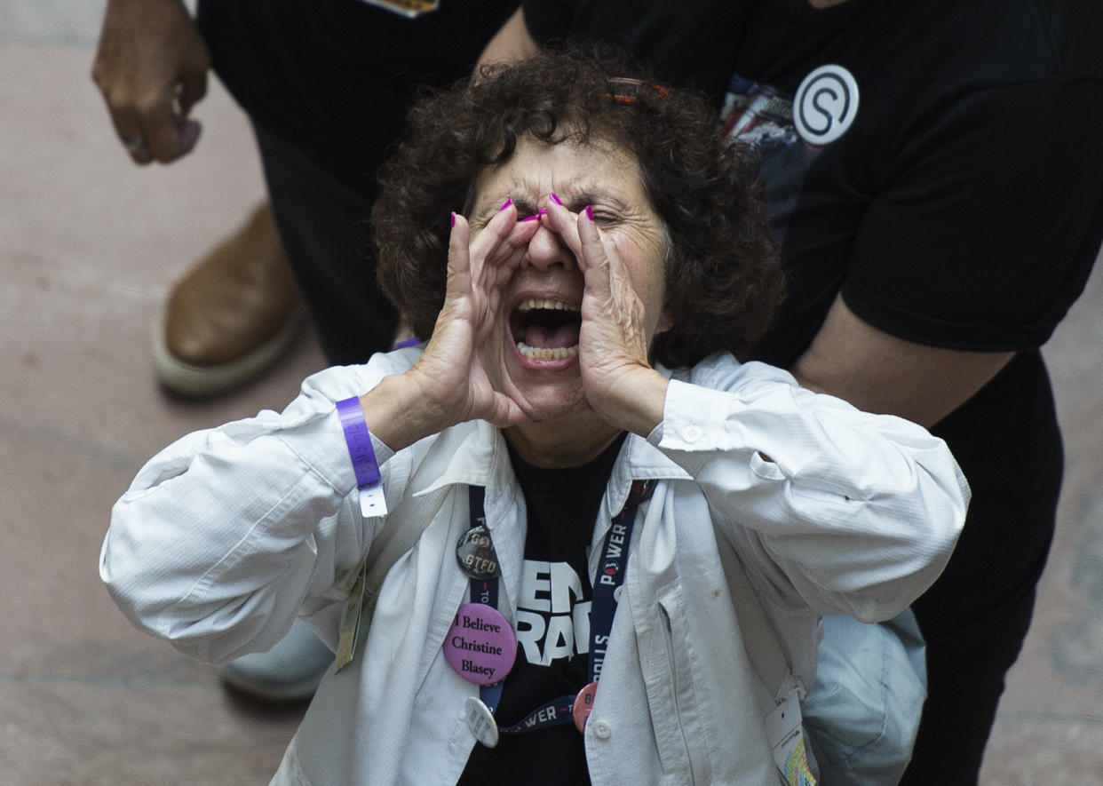 A demonstrator in the Hart Senate Office Building in Washington during a protest&nbsp;against Supreme Court nominee Brett Kavanaugh, Oct. 4. (Photo: Getty)