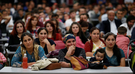 Kurdish people attend a political rally ahead of Turkey's parliamentary elections in northern Tokyo, October 15, 2015. REUTERS/Toru Hanai