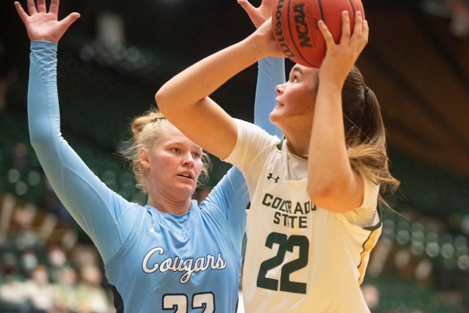 CSU's Cali Clark attempts a shot over Colorado Christian's Megan Kamps during the Rams' women's basketball season opener on Nov. 9  at Moby Arena in Fort Collins.