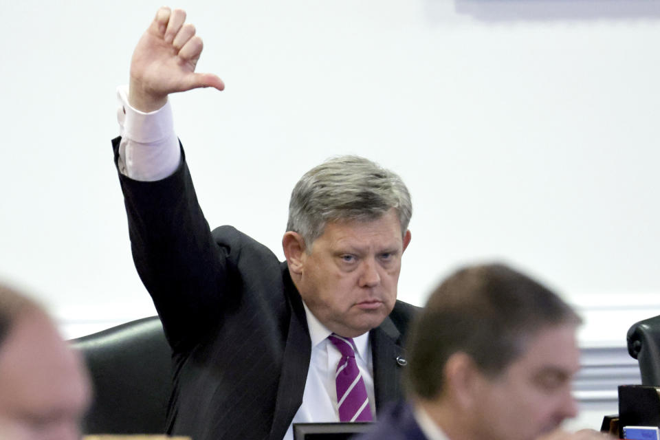 Sen. Mike Woodard, D-Durham, indicates his vote against the measure on the redistricting bill under consideration at the Legislative Building, Tuesday, Oct. 24, 2023, in Raleigh, N.C. (AP Photo/Chris Seward)