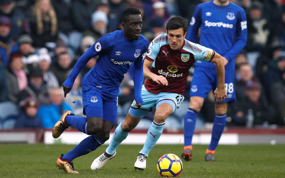 Burnley's Jack Cork challenges Everton's Idrissa Gueye - REUTERS