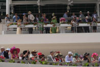 Race fans watch the paddock at Churchill Downs before the 150th running of the Kentucky Derby horse race Saturday, May 4, 2024, in Louisville, Ky. (AP Photo/Brynn Anderson)