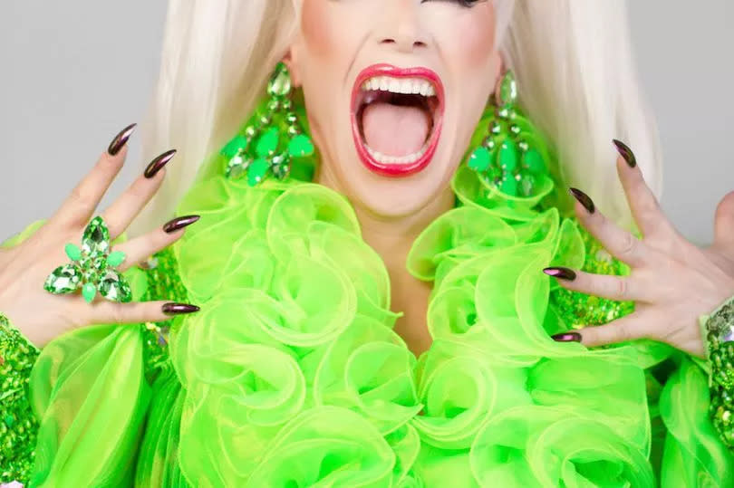 Divina de Campo wearing a neon green outfit