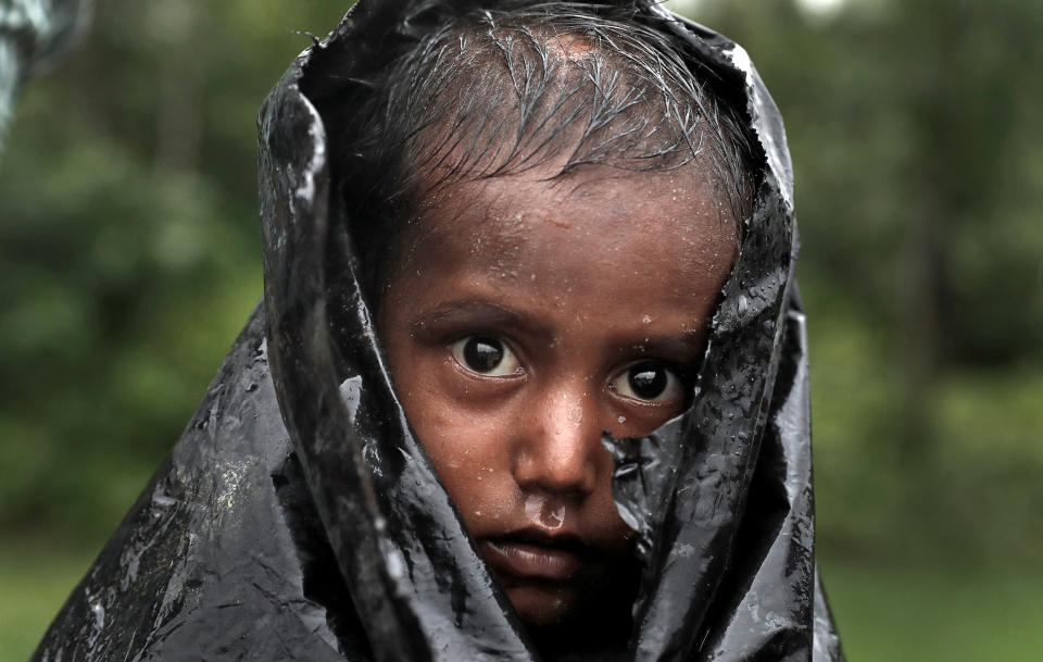 <p>A Rohingya refugee boy waits for aid in Cox’s Bazar, Bangladesh, Sept. 20, 2017. (Photo: Cathal McNaughton/Reuters) </p>