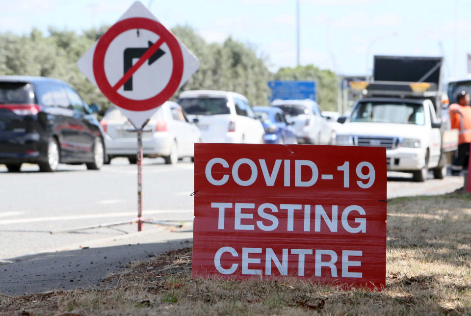 Signs direct drivers waiting for a COVID-19 testing at a pop-up testing centre at Marsden Point, New Zealand, on Monday, Jan. 25, 2021. Health officials in New Zealand say genome tests indicate the country's most recent COVID-19 patient contracted the virus from another returning traveler just before leaving quarantine. (Tania Whyte/Northern Adivacate/NZME via AP)