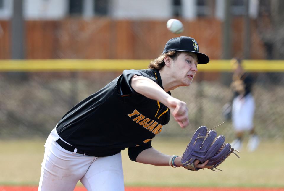 Athena’s Connor Osier delivers a pitch against Rush-Henrietta.