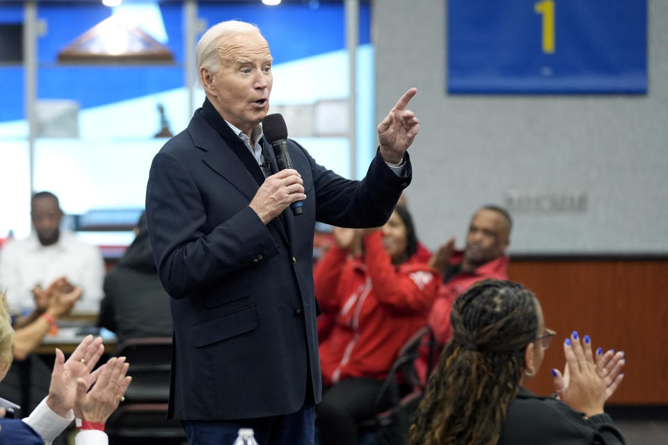 FILE - President Joe Biden meets with UAW members during a campaign stop at a phone bank in the UAW Region 1 Union Hall, Feb. 1, 2024, in Warren, Mich. Biden is dispatching several senior aides to Michigan to meet with Arab American and Muslim leaders as the administration’s handling of the Israel-Hamas war continues to frustrate members of a key constituency in a 2024 battleground state. That's according to three people familiar with the matter. (AP Photo/Evan Vucci, File)