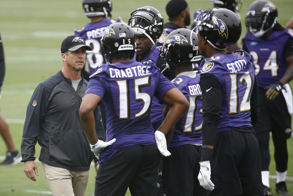 John Harbaugh and the Ravens have been fined for having contact in their OTA workouts. (AP Photo/Patrick Semansky)