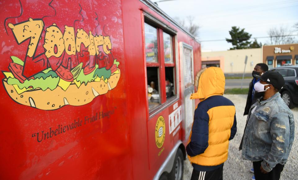 Customers line up outside of the Zoagies food truck in Pennsville in this Courier Post file photo. Zoagies food truck is coming to Mount Laurel in February and will be parked at Lakou Events most days.