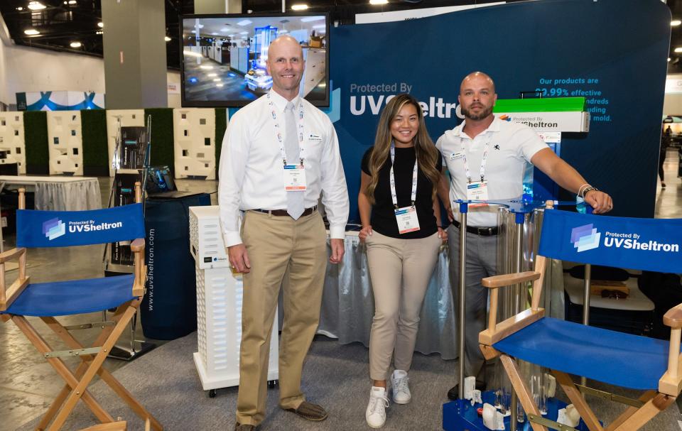 Unified Business Technologies Inc. John Palmer, Gao Vang and Mike Wilson working at Expo Tradeshow, talking up UVSheltron disinfectant Products.