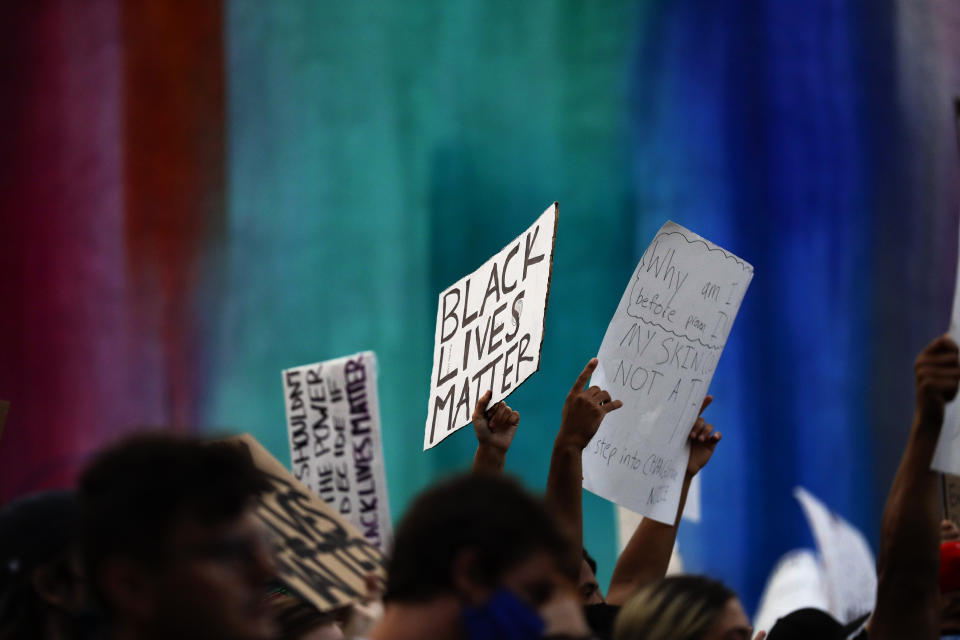 Protesters march Thursday, June 4, 2020, in San Diego over the death of George Floyd, a black man who died after being restrained by Minneapolis police officers on May 25. (AP Photo/Gregory Bull)