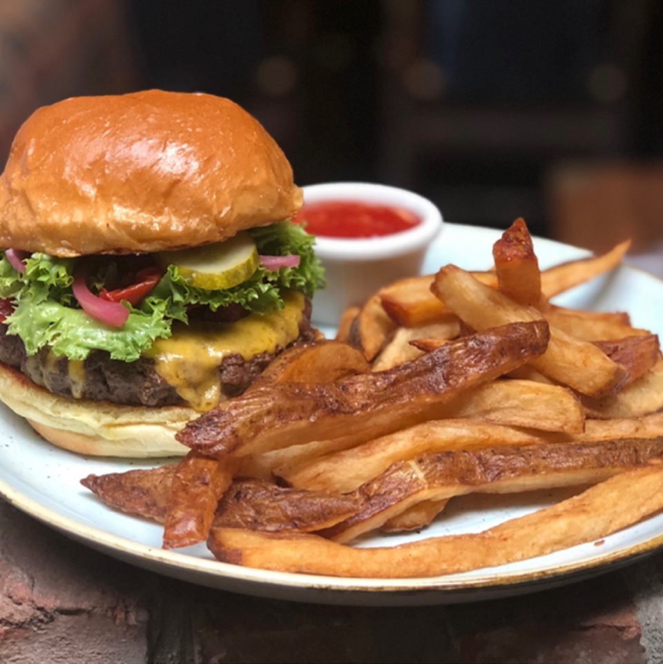 Blackhawk Farms Le Moo burger with Drunk-cut fries or truffle chips at Le Moo