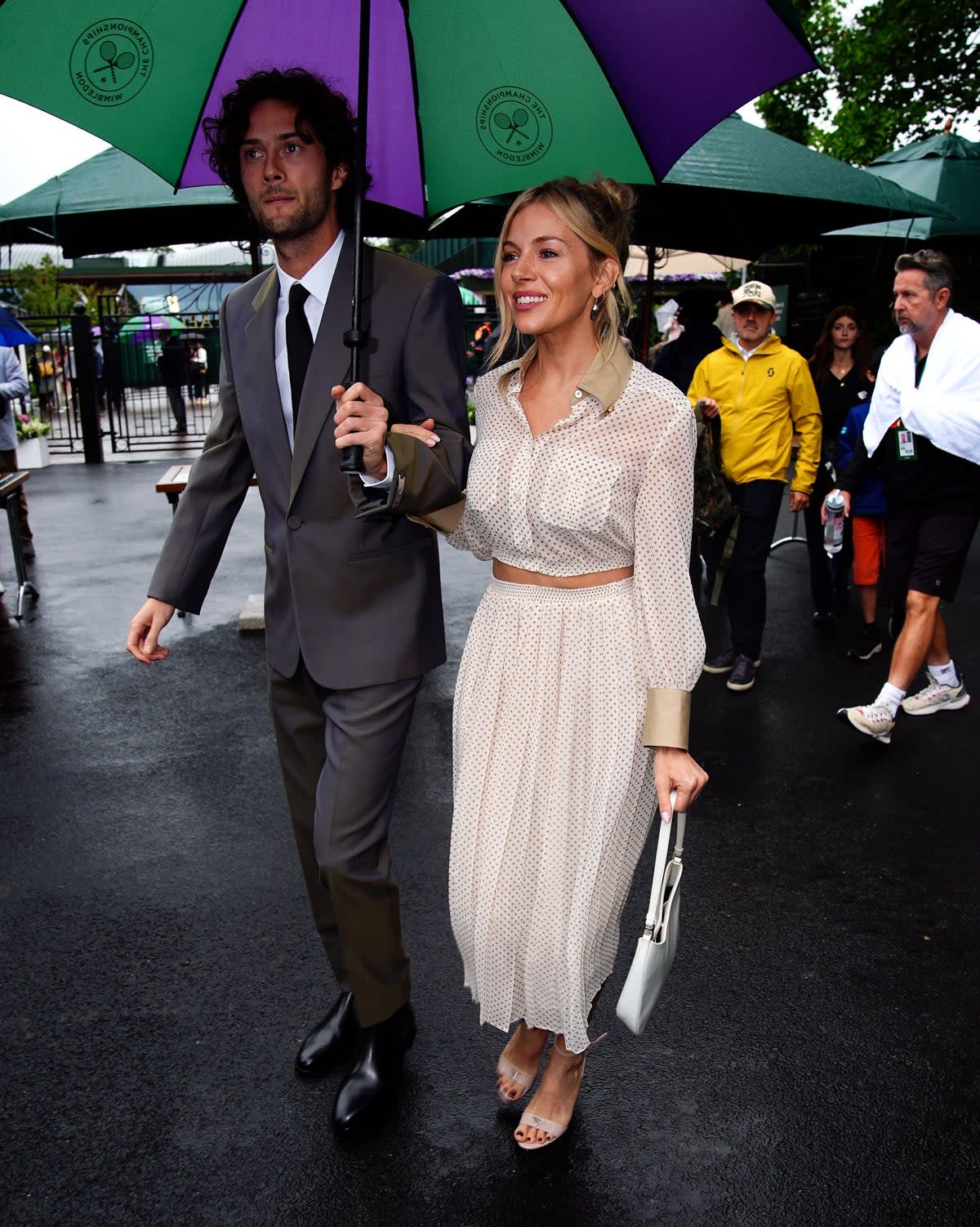 Actress Sienna Miller arrives at Wimbledon with partner Oli Green (Aaron Chown/PA Wire)