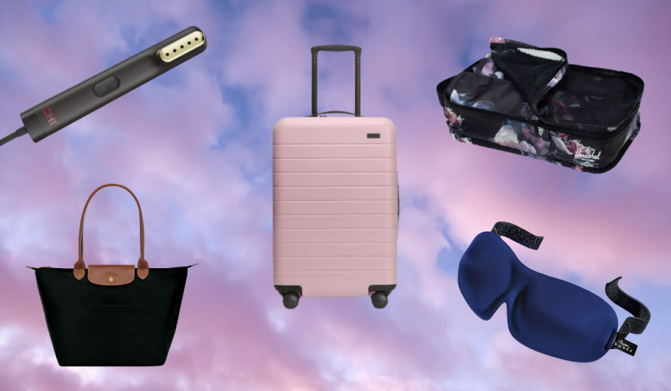 Travel-sized garment steamer, pink suitcase, black packing cubes, black purse, blue sleeping mask