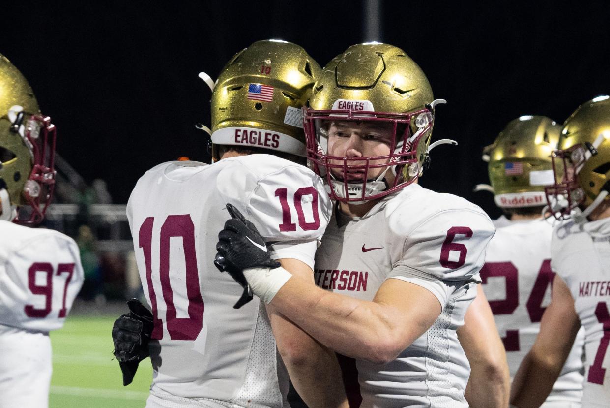 Watterson's Mark Biagi (10) and Dominic Purcell (6) celebrate a play during the state semifinal.