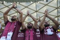 Fans of Qatar cheer as they wait for the start of a World Cup group A soccer match between Qatar and Senegal, at the Al Thumama Stadium in Doha, Qatar, Friday, Nov. 25, 2022. (AP Photo/Darko Bandic)