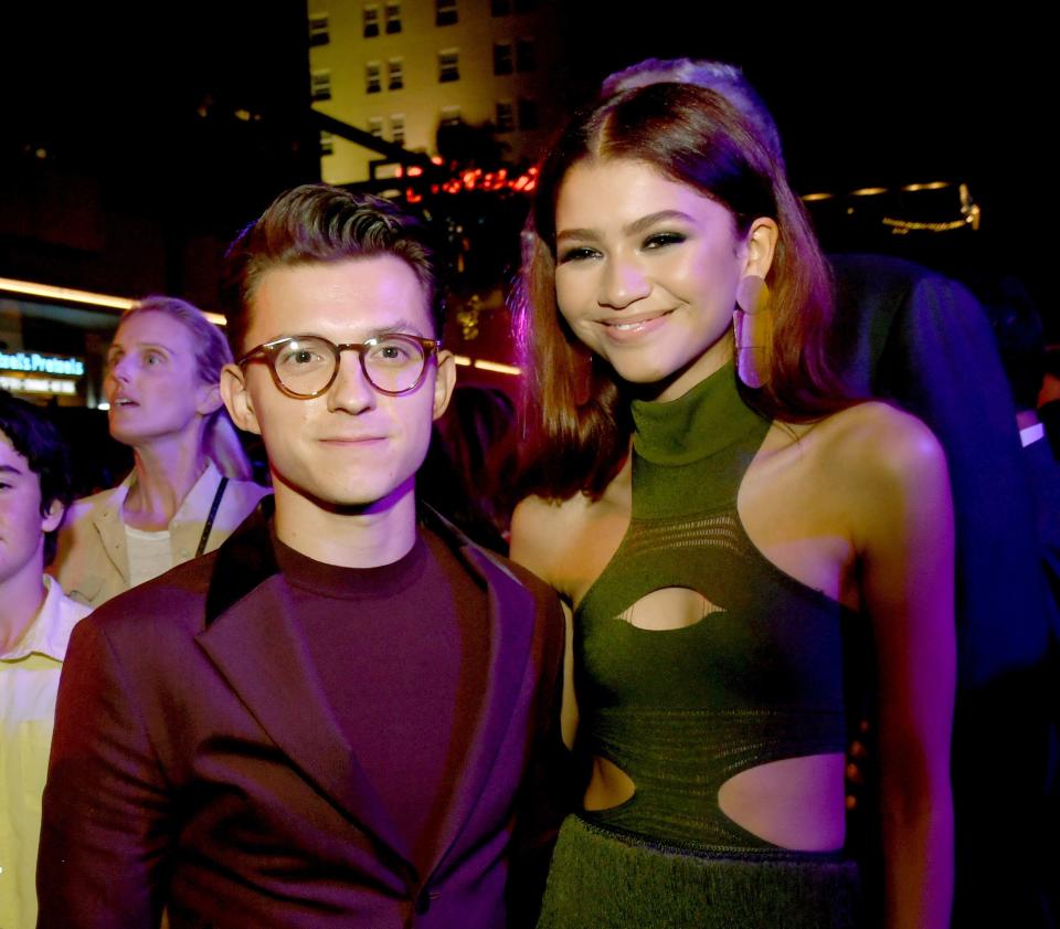 Photo of Tom Holland and Zendaya with their arms around each other's waist