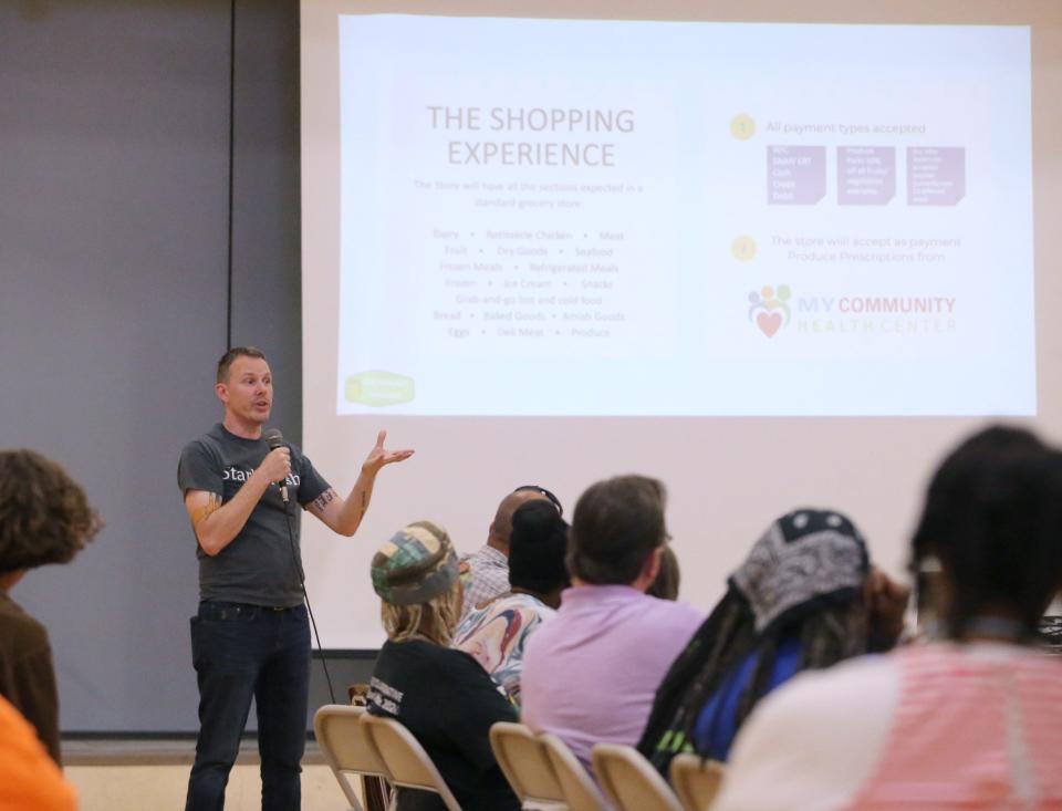 Tom Phillips, executive director of StarkFresh, speaks during a meeting for the southeast community to ask questions about the future grocery and health care center planned for Gonder Avenue in Canton.