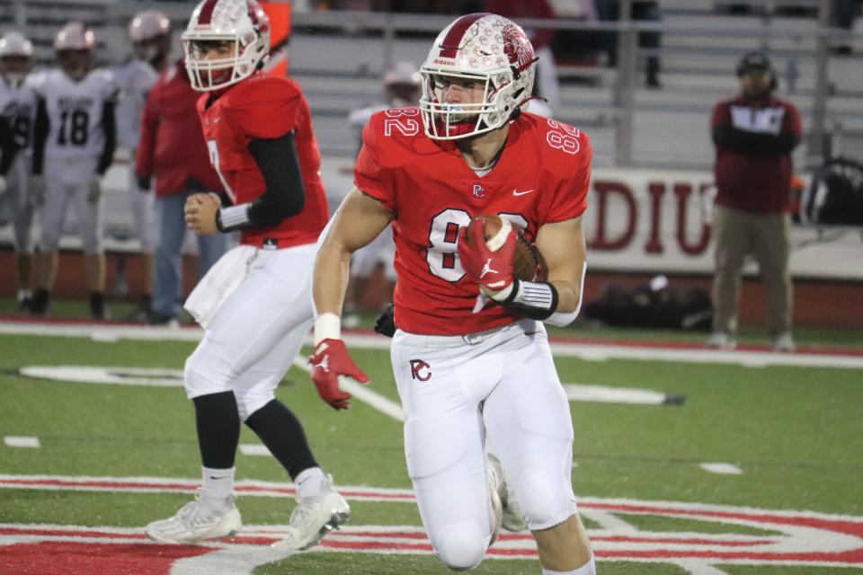 Port Clinton's Adam Thorbahn runs with a carry.