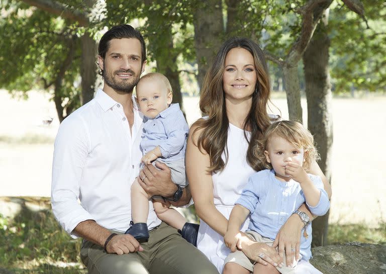 <p>Prince Carl Philip and Princess Sofia are all smiles in a portrait with their children, Prince Gabriel and Prince Alexander. The entire Swedish royal family gathered for <a href="https://www.townandcountrymag.com/society/tradition/a22778211/swedish-royal-family-portraits-summer-2018-crown-princess-victoria/" rel="nofollow noopener" target="_blank" data-ylk="slk:color-coordinated family photos" class="link ">color-coordinated family photos</a> last summer, and they did not disappoint.</p>