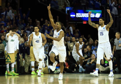 Kentucky's Aaron Harrison (2) and teammates celebrate after beating Notre Dame. (USAT)