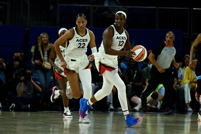 Las Vegas Aces guard Chelsea Gray (12) moves the ball up court alongside forward A'ja Wilson (22) during a July 26 game.