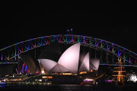 <p>The Sydney Harbour Bridge is lit in rainbow colors to honor the victims of the Orlando nightclub mass shooting, June 13, 2016. (EPA/Sam Mooy) </p>