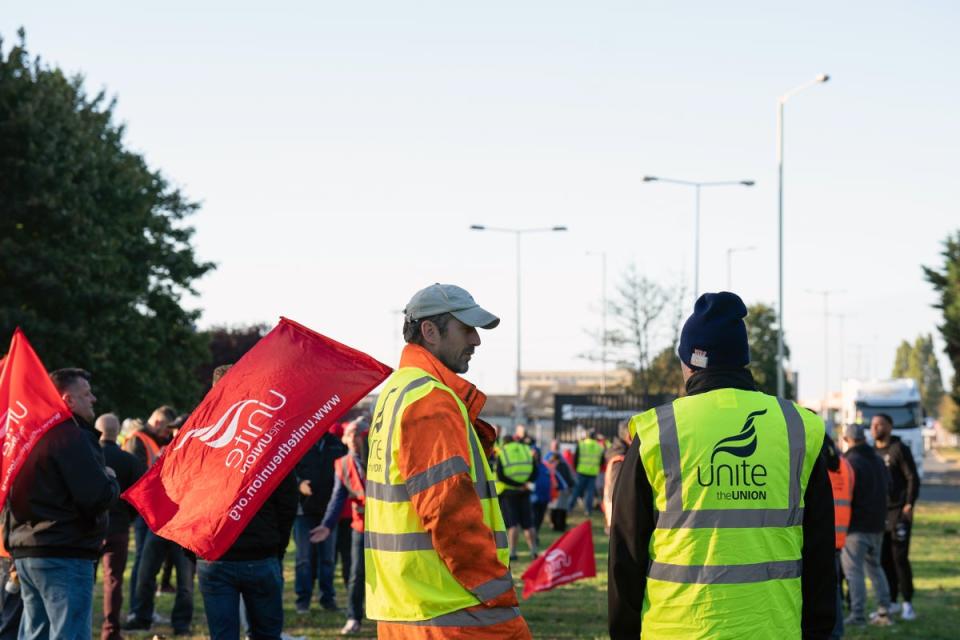 Members of the Unite union man a picket line at one of the entrances to the Port of Felixstowe in Suffolk (Joe Giddens/PA) (PA Wire)