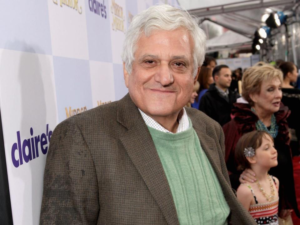 Michael Lerner in a grey jacket and greet vest