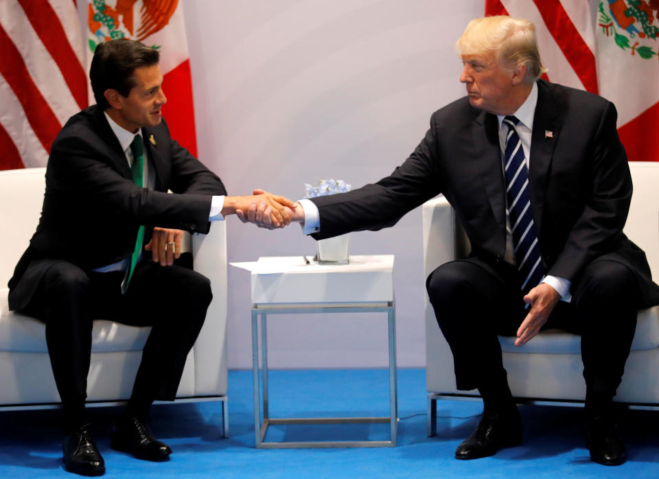 Trump shakes hands with Mexico's President Enrique Pena Nieto during a&nbsp;bilateral meeting at the G-20 summit in Hamburg, Germany, in July. (Photo: Carlos Barria / Reuters)