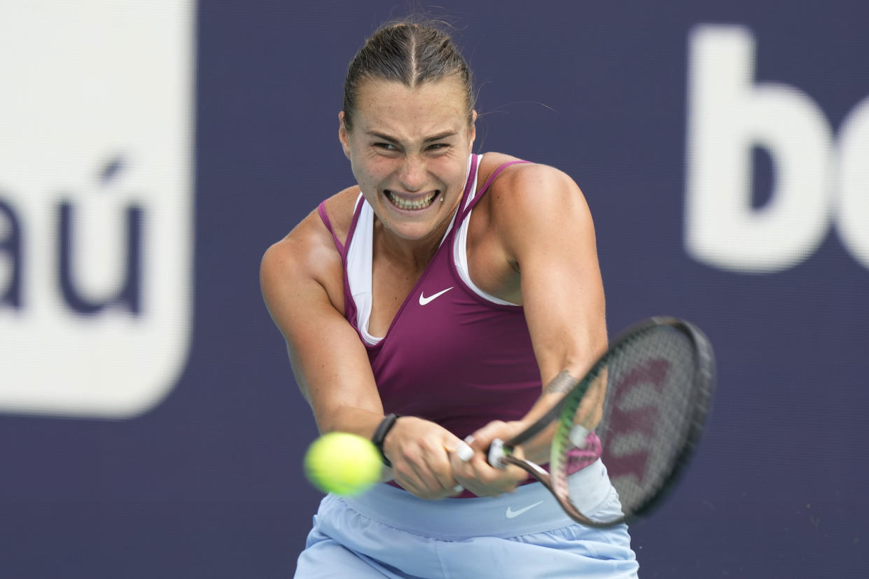 Aryna Sabalenka returns to Sorana Cirstea of Romania during the Miami Open tennis tournament, Wednesday, March 29, 2023, in Miami Gardens, Fla. (AP Photo/Marta Lavandier)