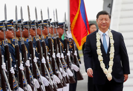 China's President Xi Jinping walks past honour guards upon his arrival at Ninoy Aquino International airport during a state visit in Manila, Philippines, November 20, 2018. REUTERS/Erik De Castro