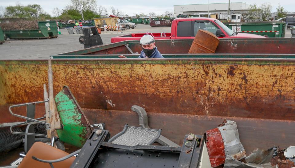 Northside Drop Off Center Location Supervisor Mike Lewand looks in Waste Management bins Tuesday, May 4, 2021, located at 6660 N. Industrial Rd., Milwaukee.