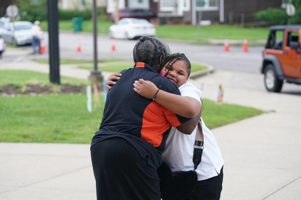 Melody McNeely hugs a student during Officer Elementary’s first day of the school year on Aug. 14, 2023. Lincoln Middle School and Officer Elementary opened on the same day, each filled with staff and community partners cheering on students as they entered the building.