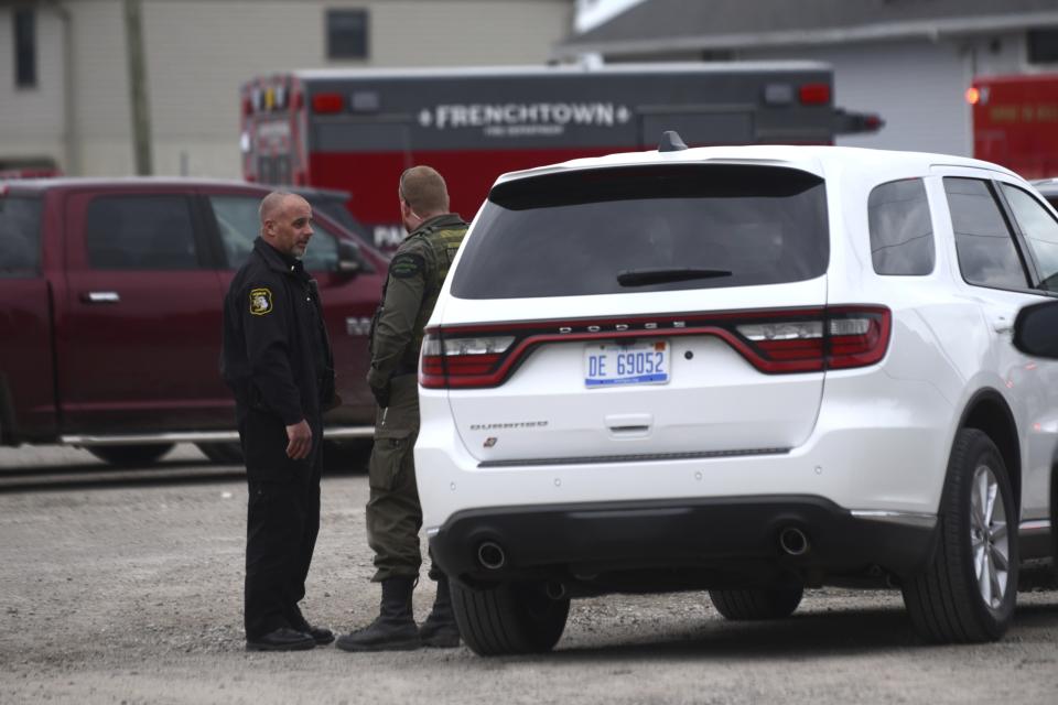 Authorities respond to the Swan Creek Boat Club after a driver crashed a vehicle through a building where a children's birthday party was taking place, Saturday, April 20, 2024, in Berlin Township, Mich. (Kathleen Kildee/Detroit News via AP)