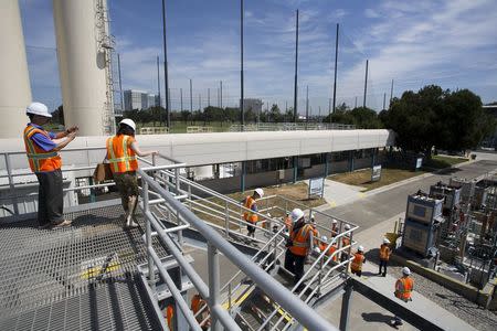 Members of the public walk through the Edward C. Little Water Recycling Facility during the West Basin Municipal Water District's tour of a water recycling facility in El Segundo, California July 11, 2015. REUTERS/David McNew