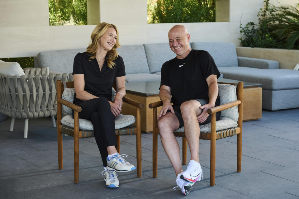 In this photo provided by Horizon Sports & Experiences, Steffi Graf and Andre Agassi laugh during a break in a pickleball event in Las Vegas, Sept. 28, 2023. At first, Andre Agassi was perplexed by the pickleball craze. He just didn’t understand the appeal. Now, the Hall of Fame tennis player can’t get enough of hitting drop shots and charging toward the kitchen (pickleball term). (Brandon Ho/Horizon Sports & Experience via AP)