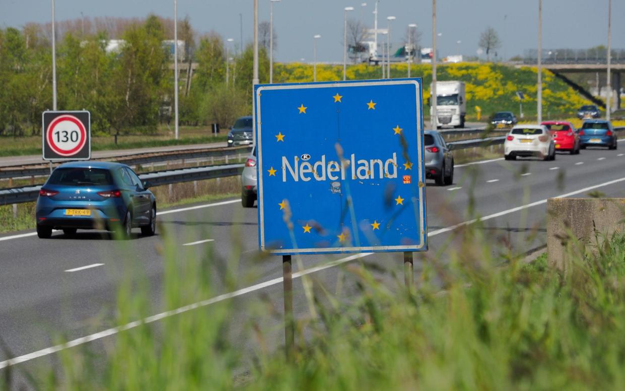 Cars entering the Netherlands on a motorway