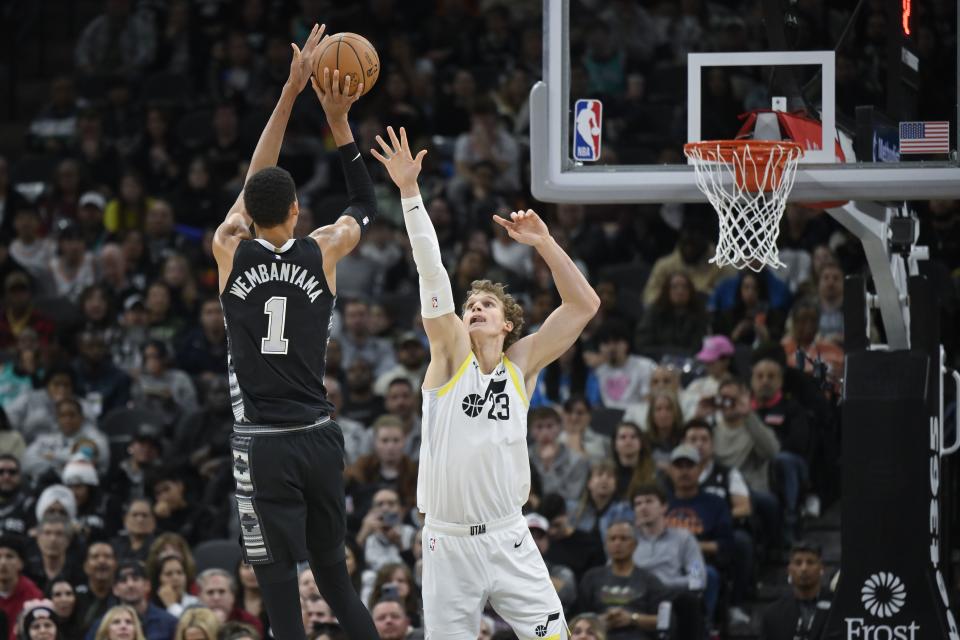 San Antonio Spurs’ Victor Wembanyama (1) shoots against Utah Jazz’s Lauri Markkanen during the second half of an NBA basketball game, Tuesday, Dec. 26, 2023, in San Antonio. Utah won 130-118. | Darren Abate, Associated Press