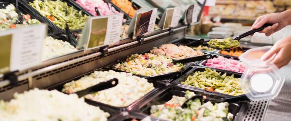 Close up view of an appetizing buffet of prepared meal in grocery store