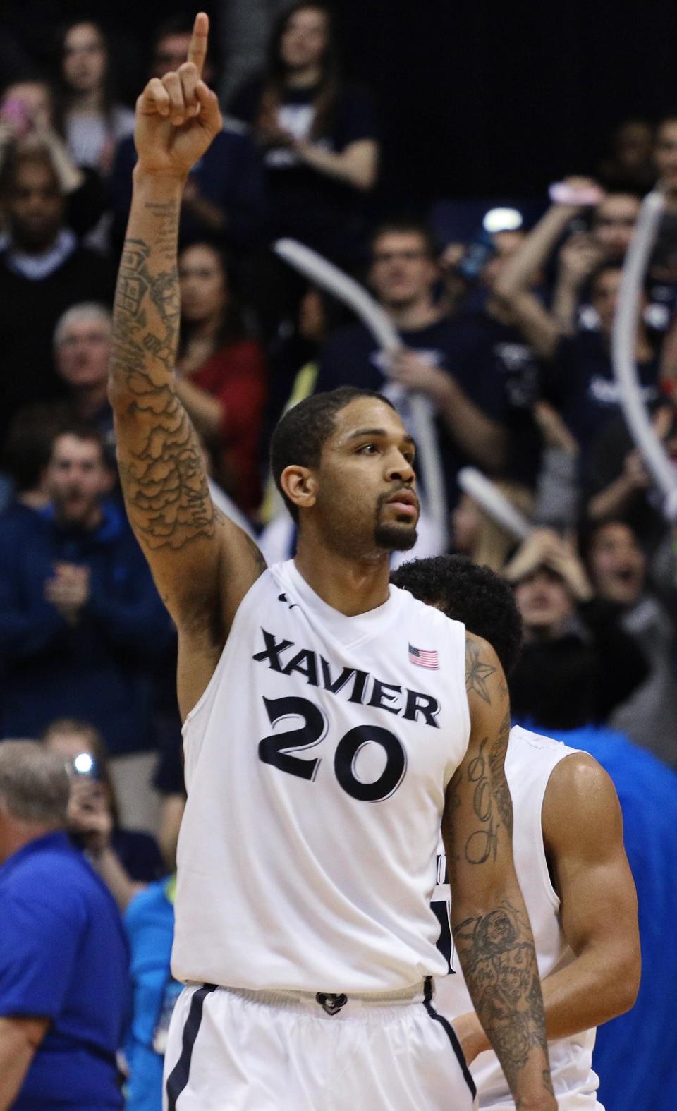 Xavier's Justin Martin reacts at the end of Xavier's 75-69 win over Creighton in an NCAA college basketball game in Cincinnati on Saturday, March 1, 2014. (AP Photo/Tom Uhlman)