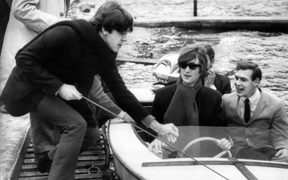 Paul McCartney and John Lennon on Loch Earn in 1964 - Getty