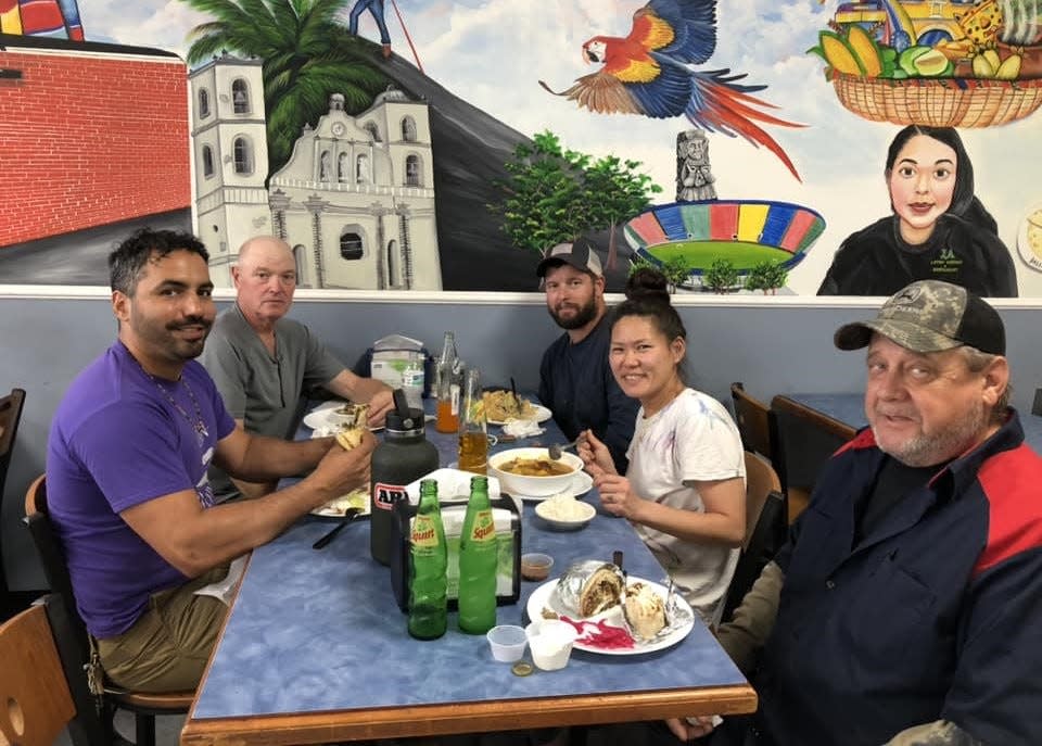 From left to right, Matthew Henry, Michael, Jeffrey and Jisun Morris and George Self dine at J&A Latino Market and Restaurant in Hopewell, Virginia on May 14, 2024.