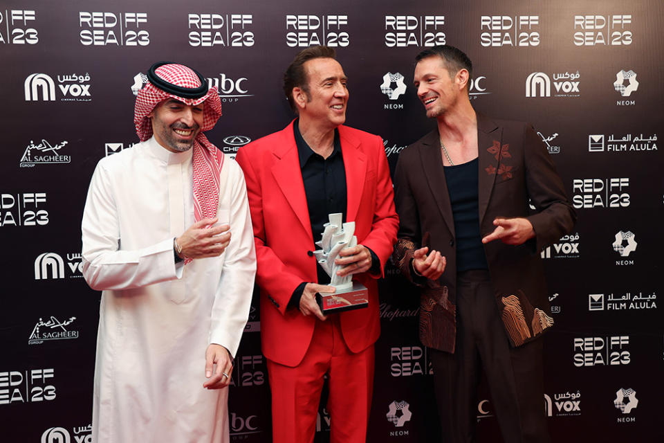 CEO of the Red Sea International Film Festival Mohammed Al Turki, Nicolas Cage and jury member Joel Kinnaman pose with the Honourary Award given to Nicolas Cage at the Closing Ceremony at the Red Sea International Film Festival 2023 on December 07, 2023 in Jeddah, Saudi Arabia.