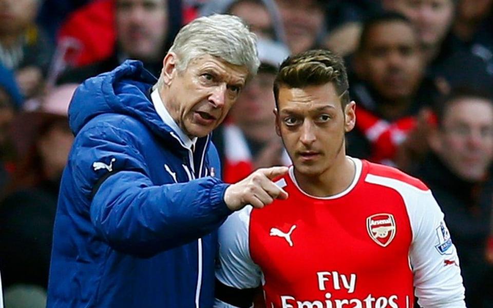 Arsene Wenger was Arsenal coach when the club gave Mesut Ozil his £350,000 a week contract  - REUTERS