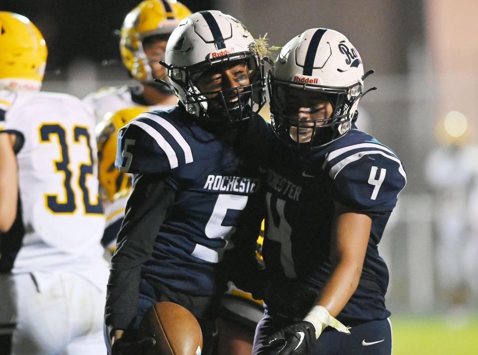 Rochester's DJ Smith (5) and Antonio Laure (4) celebrates Smith's two-point conversion against Shenango during Friday night's game at Rochester High School.