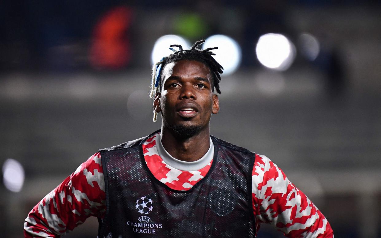 This file photo taken on November 02, 2021 shows Manchester United's France's midfielder Paul Pogba warming up ahead of the UEFA Champions League group F football match between Atalanta and Manchester United at the Azzurri d'Italia stadium, in Bergamo - AFP